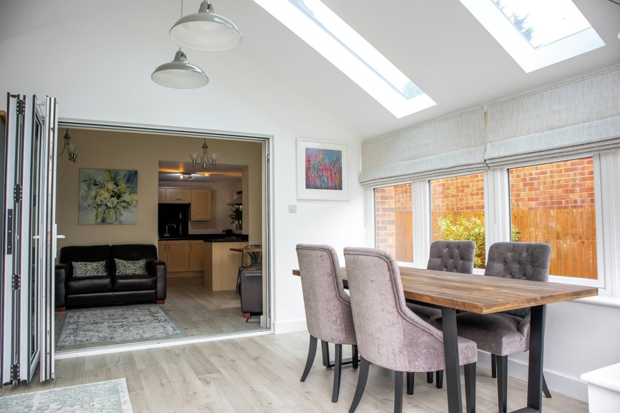 Bright open-plan extension with smooth, freshly decorated walls and a vaulted ceiling