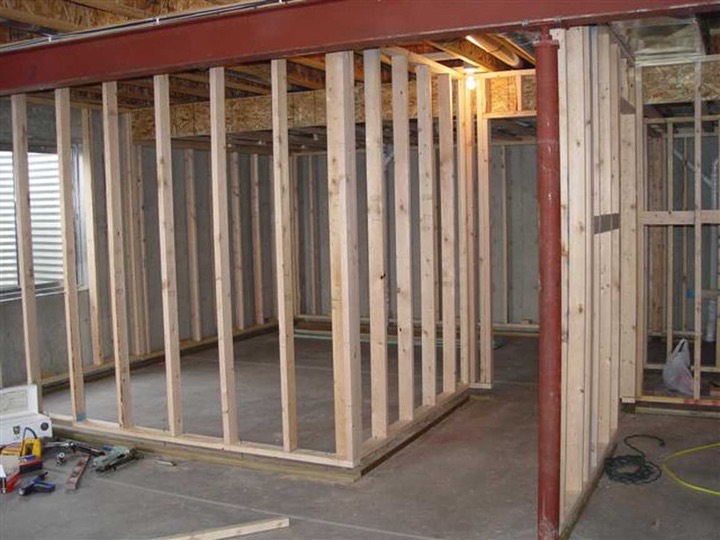 Timber stud wall frames dividing a room